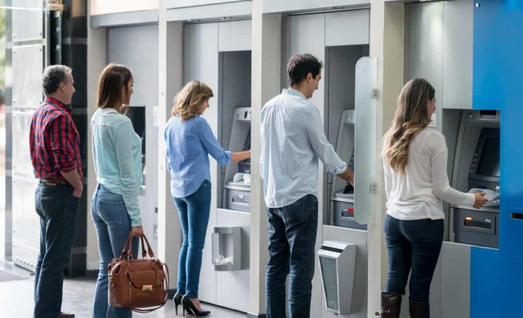 The TFSA Withdrawal Rule Every Canadian Should Know Group of people in a line at an ATM waiting to make a cash withdrawal